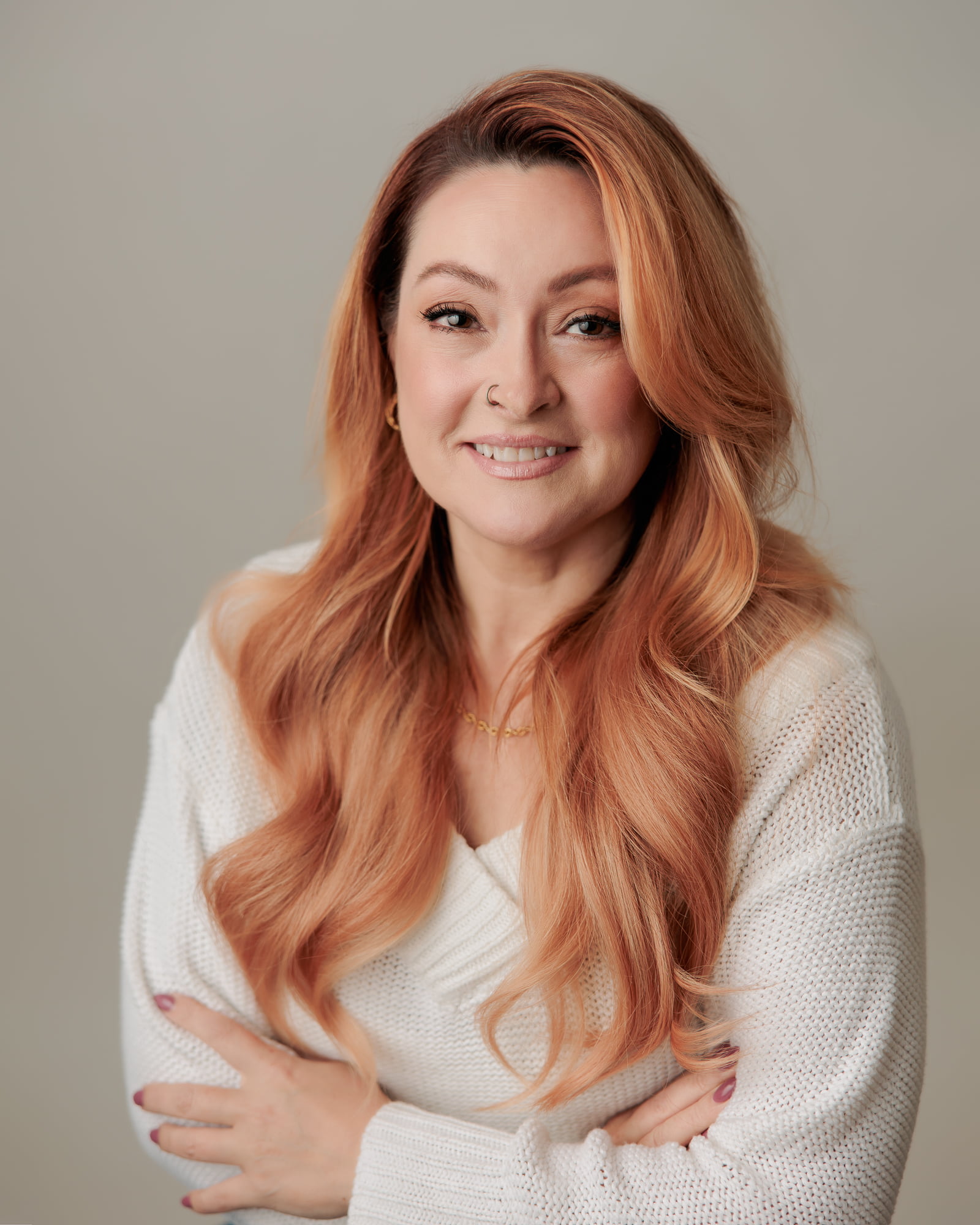 headshot of woman with crossed arms