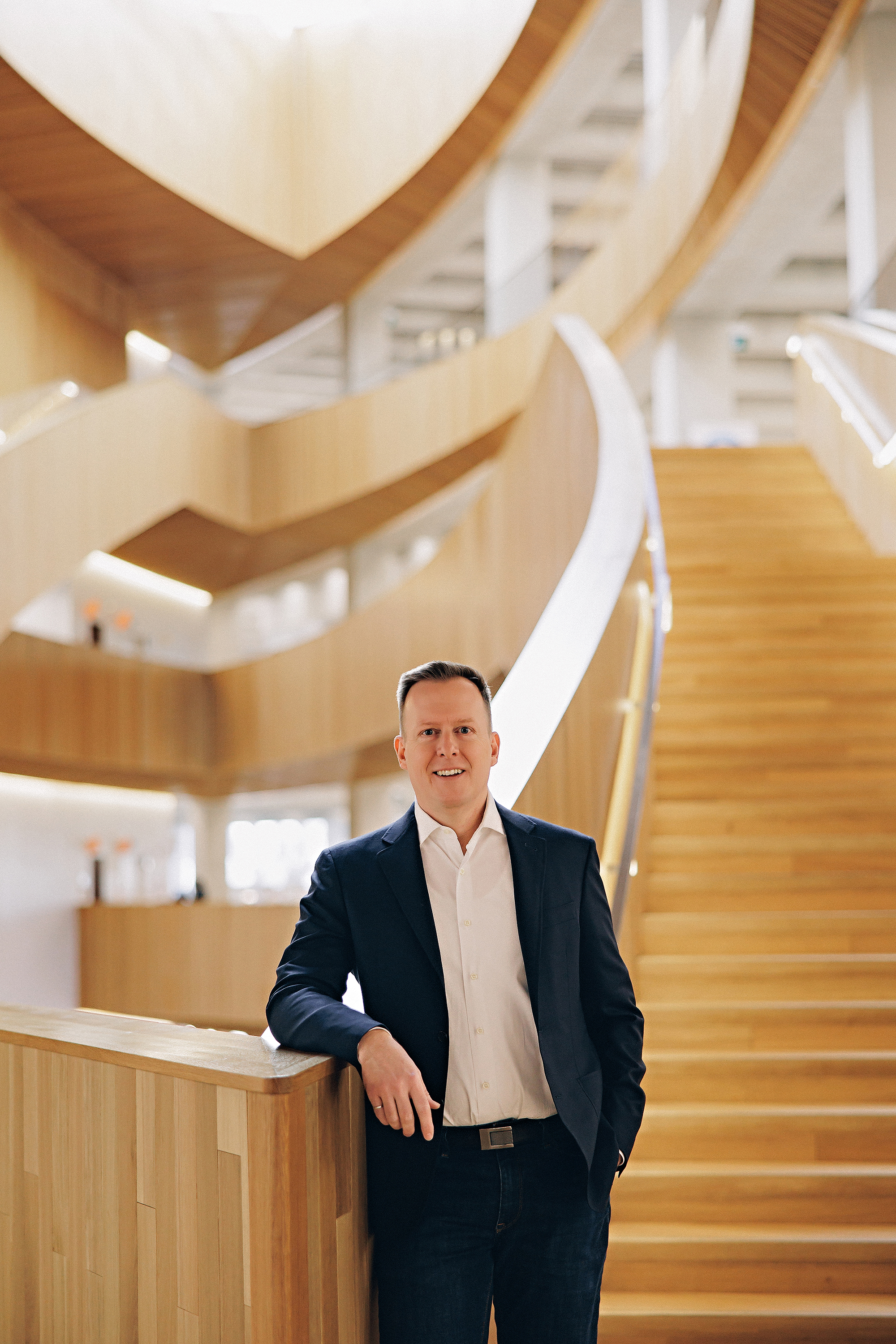 man standing in front of stairs for branding photos in Calgary