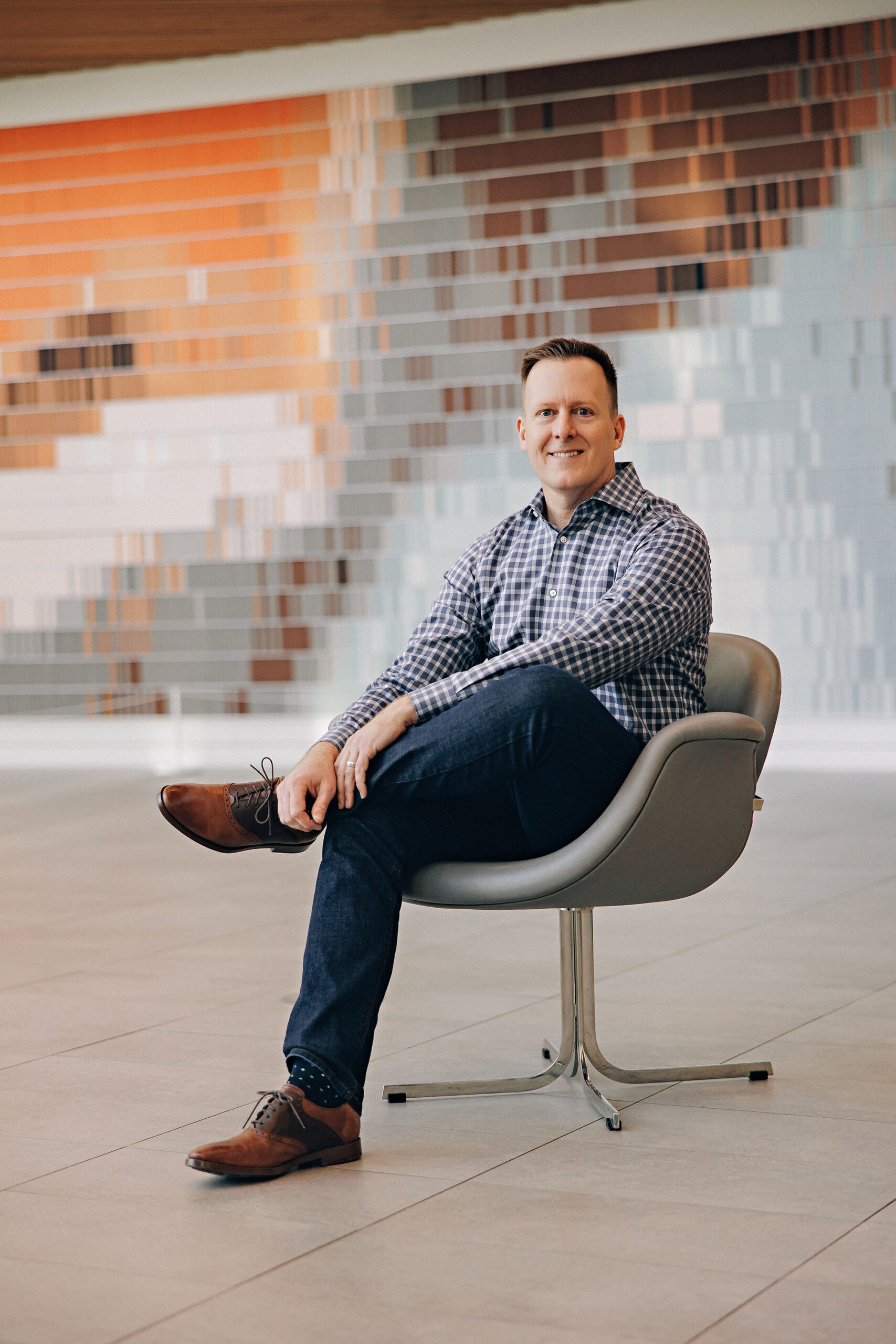 man sitting on a chair for branding photos