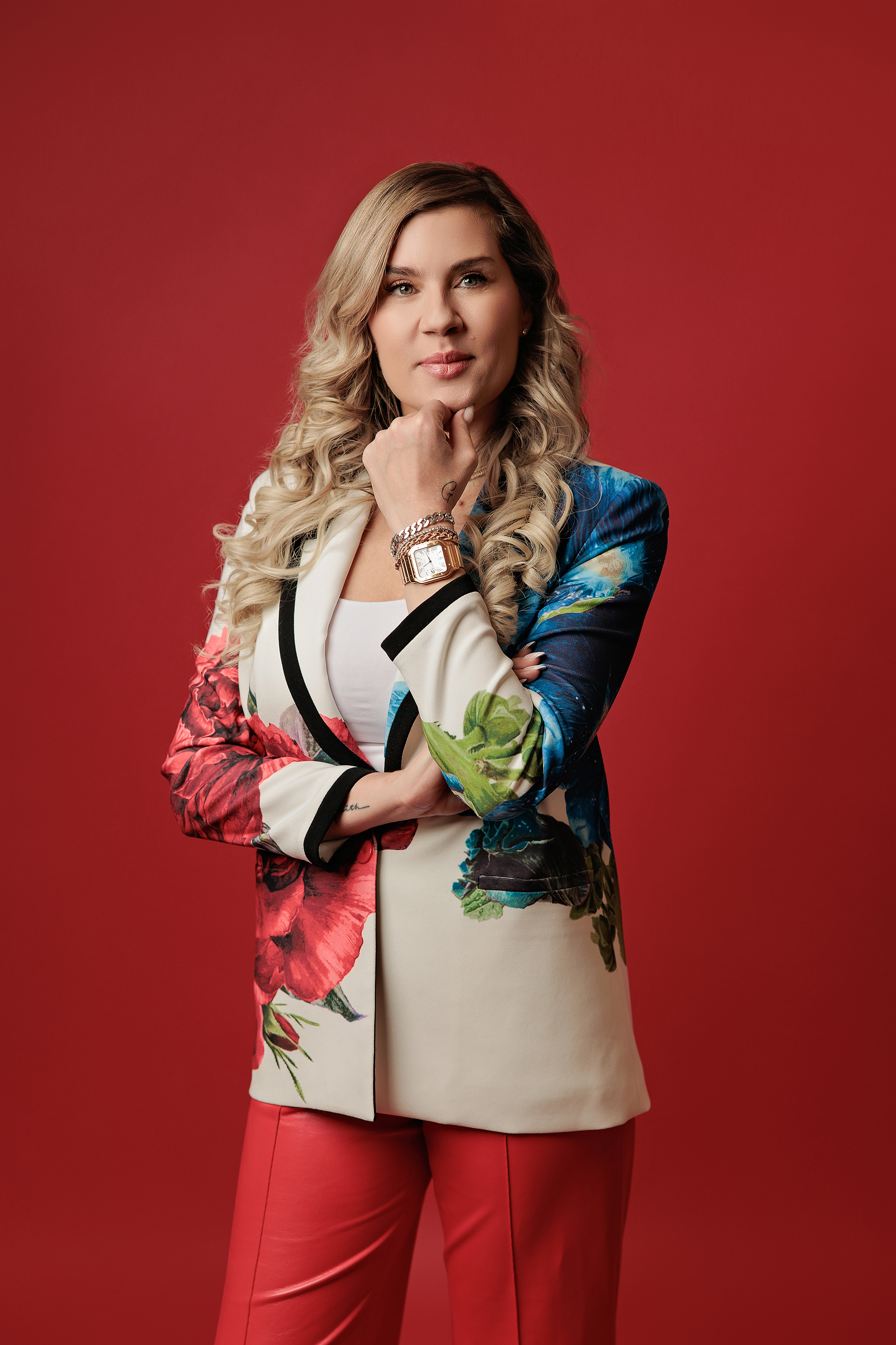 woman photo on red backdrop looking at the camera